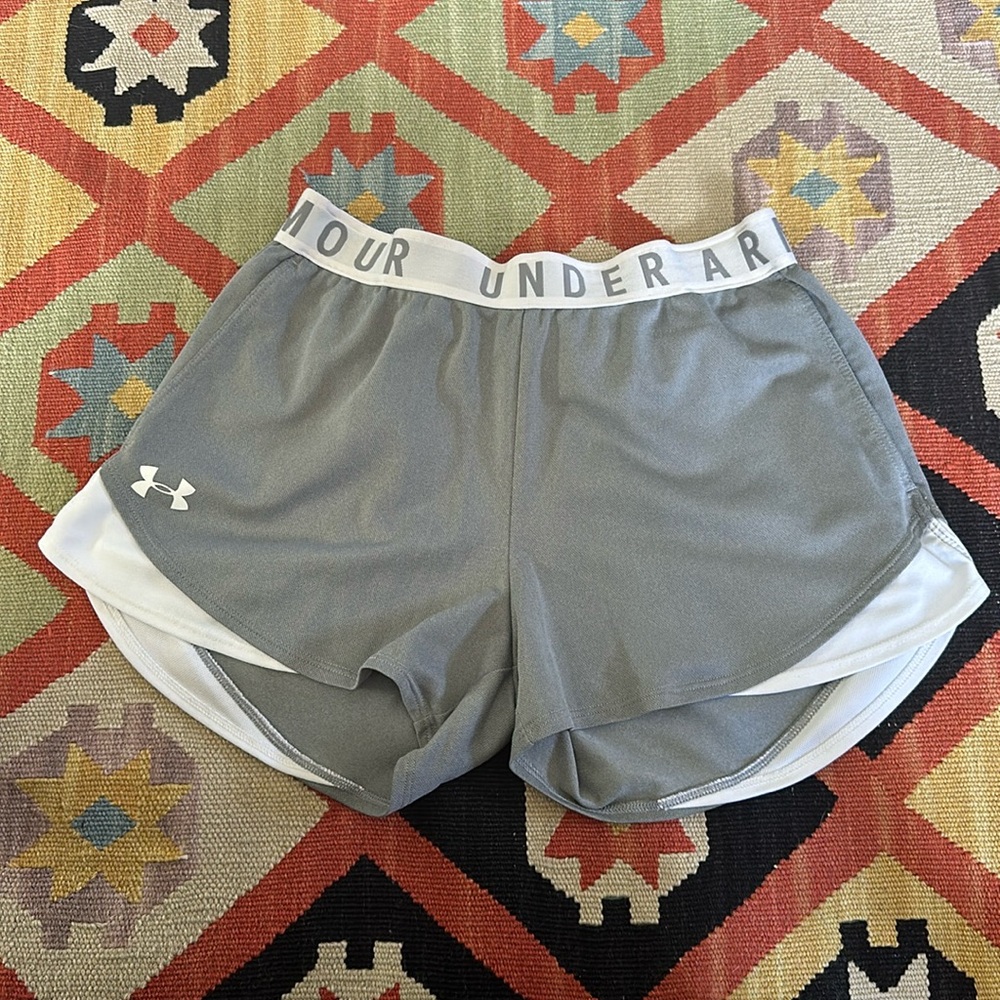Grey Under Armour shorts. Size small with two pockets